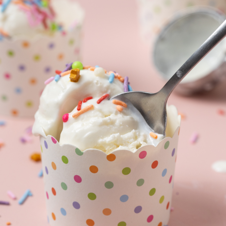 Scoop of copycat Culver's frozen custard in a glass dish with a spoon