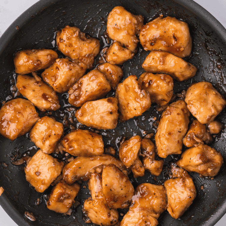 Basting grilled chicken with sweet and smoky brown sugar marinade