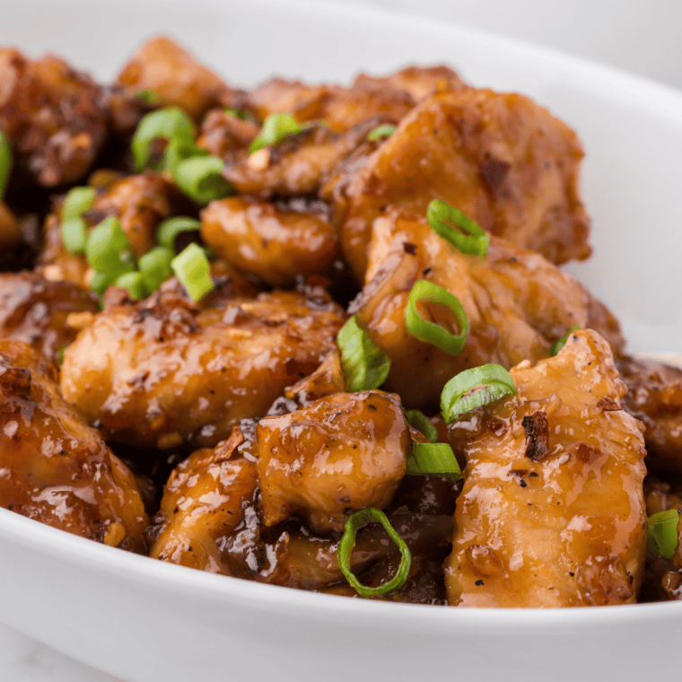 Plate of grilled chicken glazed with copycat Lawry's hickory brown sugar marinade