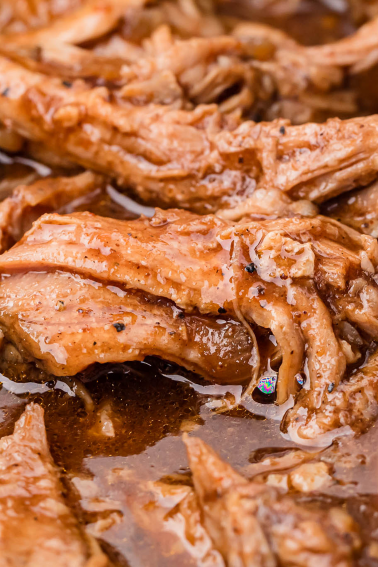 Shredded pork coated in homemade al pastor seasoning, ready for tacos
