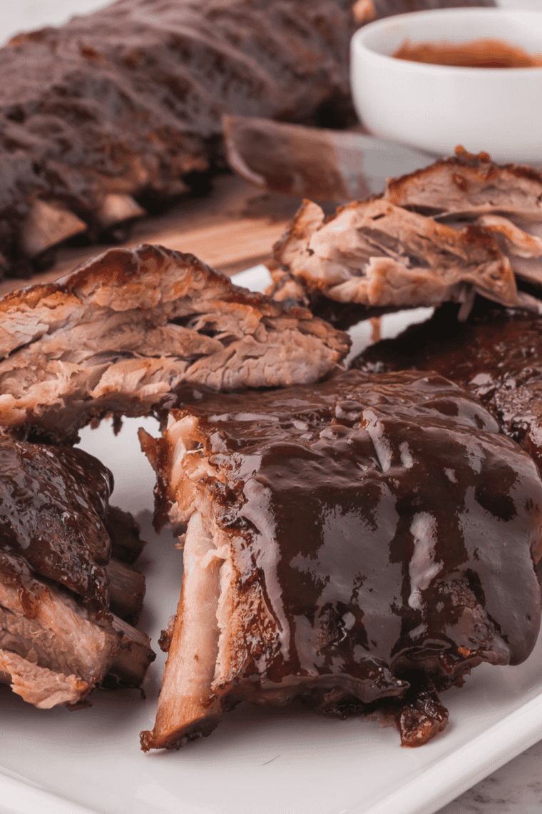 Sticky, caramelized ribs brushed with Copycat Stubb's Dr Pepper Barbecue Sauce