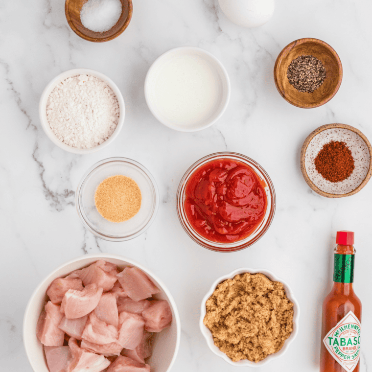 Ingredients for Copycat Stubb's Dr Pepper Barbecue Sauce, including Dr Pepper, tomato puree, brown sugar, molasses, vinegar, Worcestershire sauce, and spices