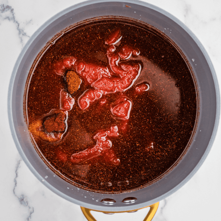 Tomato puree, tomato paste, vinegar, brown sugar, molasses, and Worcestershire sauce whisked into the Dr Pepper reduction until smooth