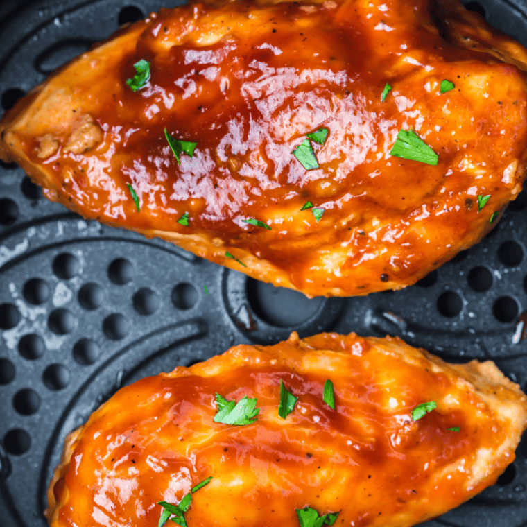Copycat Stubb's Dr Pepper Barbecue Sauce being brushed onto grilled chicken