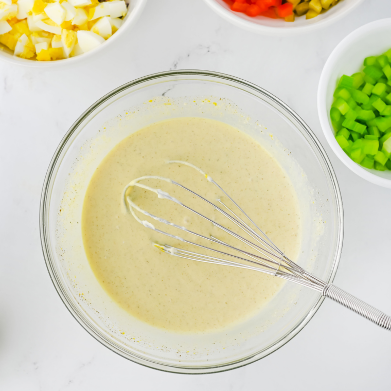 Blended cottage cheese dressing in a food processor, smooth with no visible curds