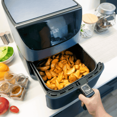 Basket-style air fryer on a kitchen counter ready to cook — clean, generic, works for most hero shots.