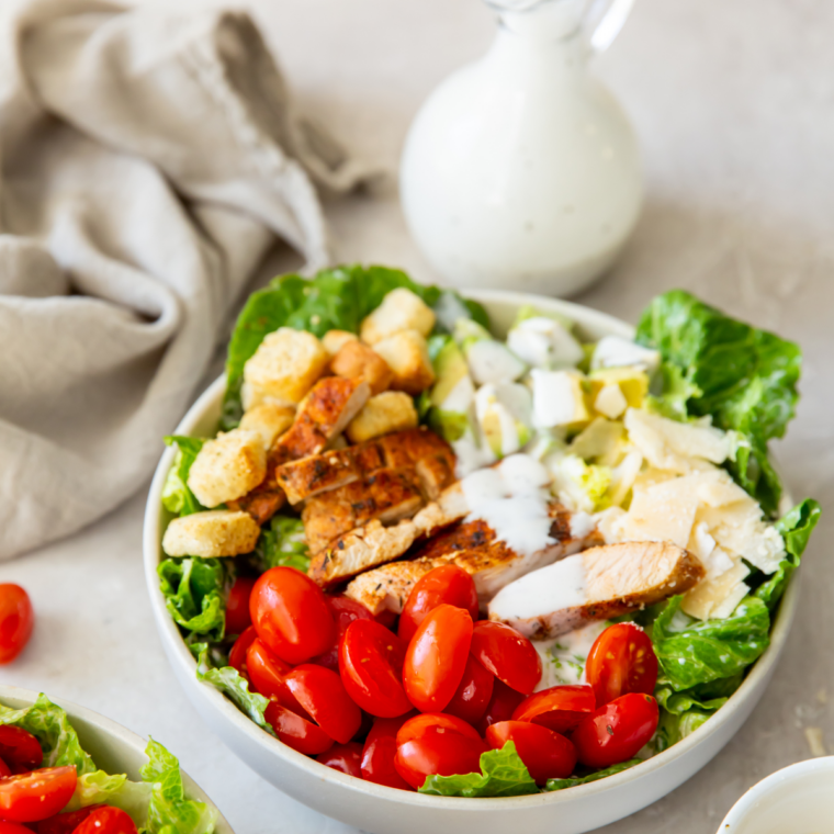 Crisp romaine Caesar salad topped with copycat LongHorn Caesar dressing and Parmesan