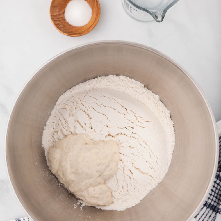 Kneading honey wheat dough for copycat Longhorn Steakhouse bread on a floured surface