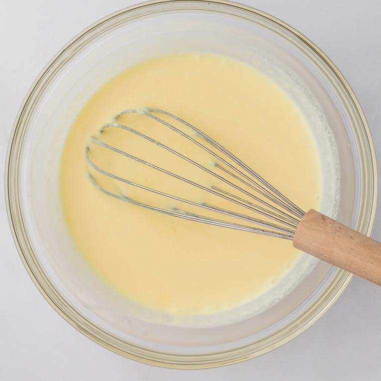 Whisking milk, cream, sugar, and vanilla into a Ninja Creami blizzard base