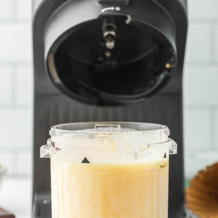 Frozen pint locked into the Ninja Creami machine on the Ice Cream setting