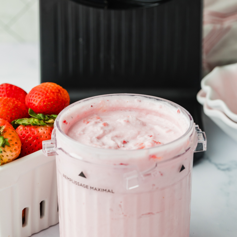Close up of creamy Ninja Creami Blue Bell Strawberry ice cream showing real strawberry chunks