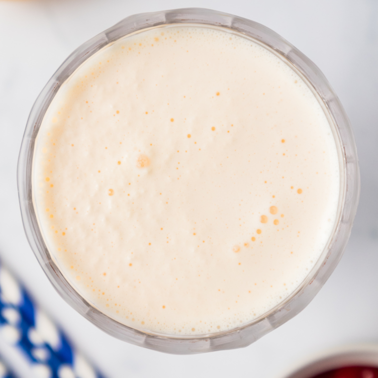 Simply Lemonade, milk, and vanilla ice cream combined in a Ninja Creami Pint bowl