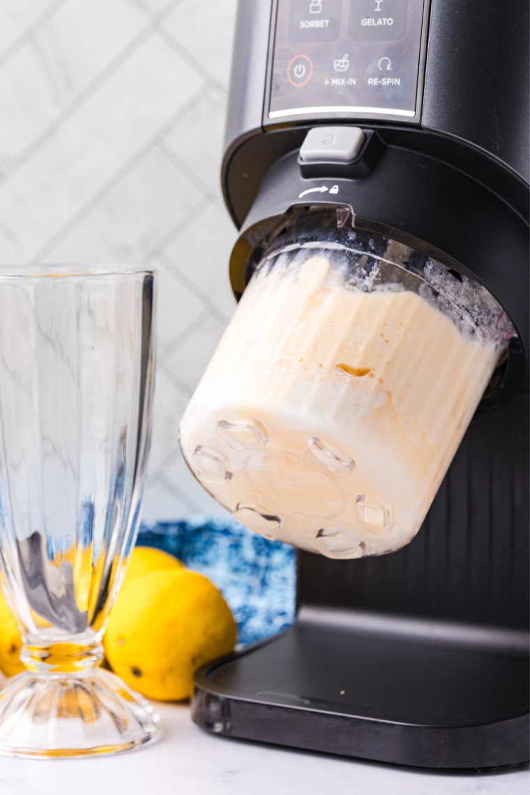 Ninja Creami Pint bowl locked onto the machine base with the handle twisted into place