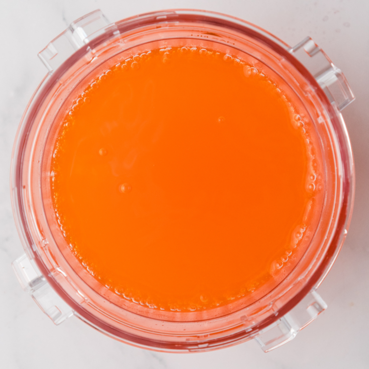 Fanta and water combined in a Ninja Creami pint container