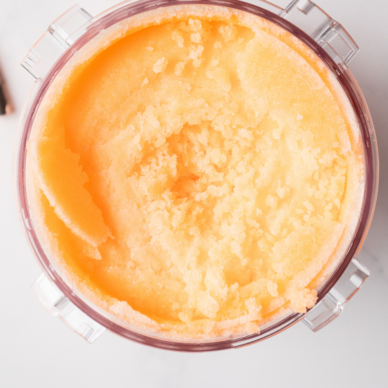 Vanilla ice cream scooped on top of orange Fanta slush