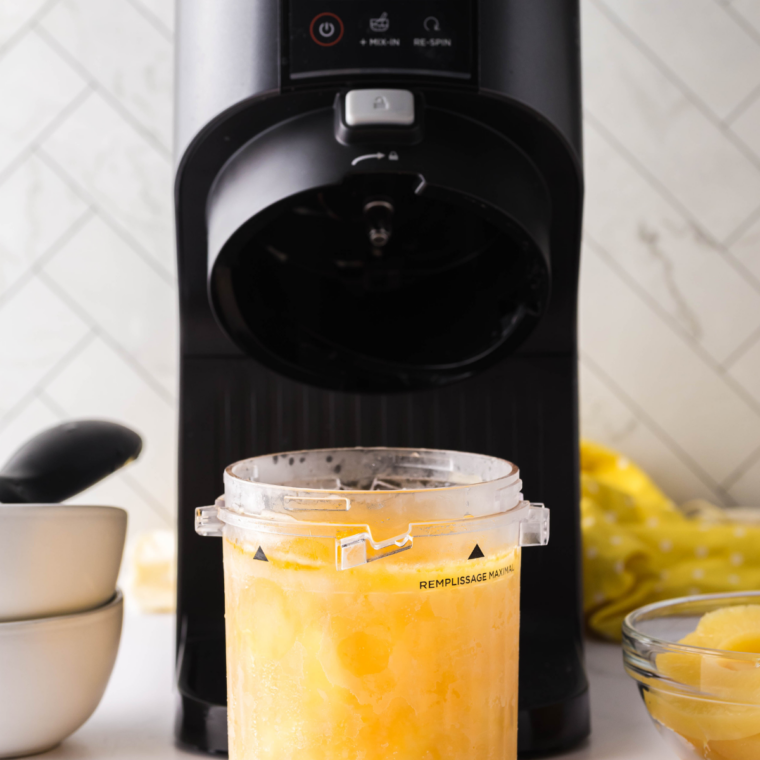 Frozen Ninja Creami pint of lemon Italian ice ready to be spun in the machine