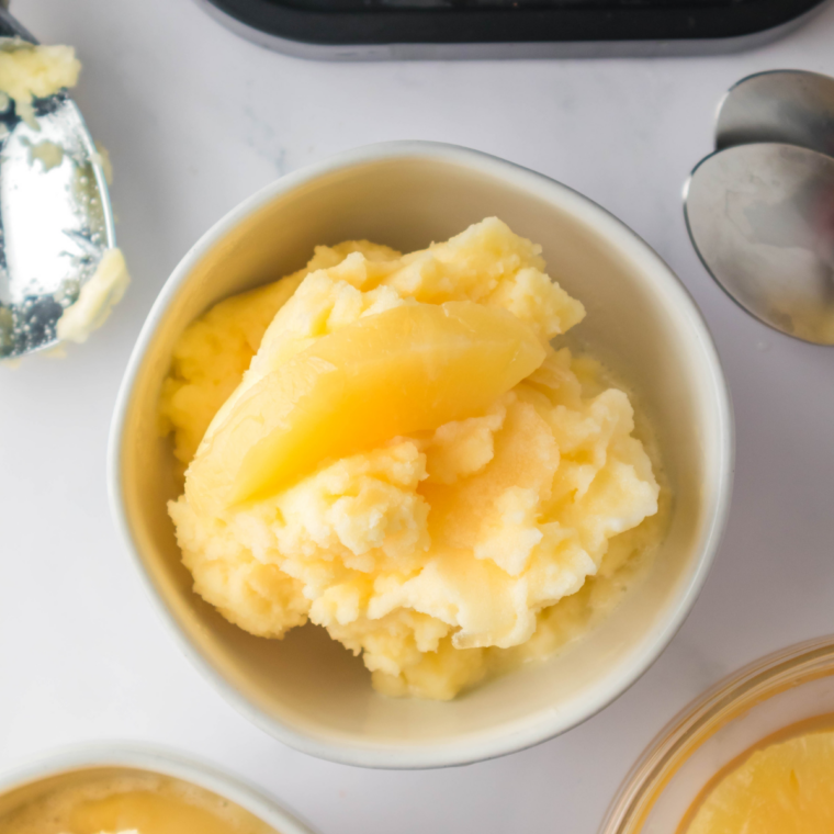 White bowl of homemade lemon Italian ice made in the Ninja Creami