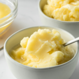 Scoops of Ninja Creami Lemon Italian Ice in a bowl garnished with mint