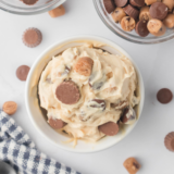 Ninja Creami Peanut Butter Cup Perfection ice cream scooped into a bowl with peanut butter cups on top