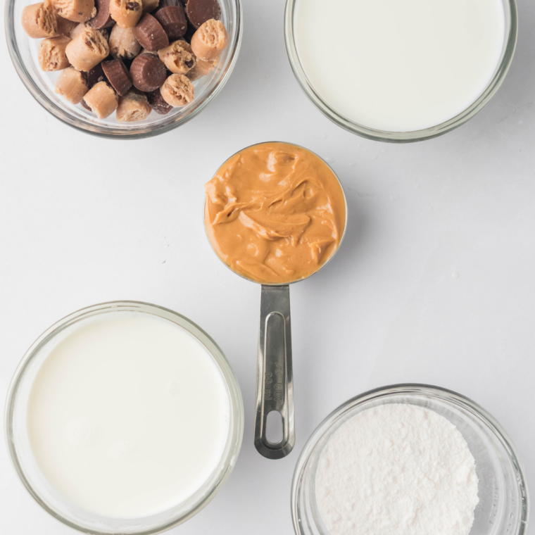 Ingredients for Ninja Creami Peanut Butter Cup Perfection: milk, cream, peanut butter, cocoa, sugar, and peanut butter cups