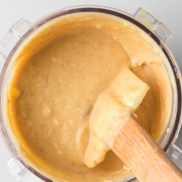 Chocolate peanut butter base poured into a Ninja Creami pint before freezing for 24 hours
