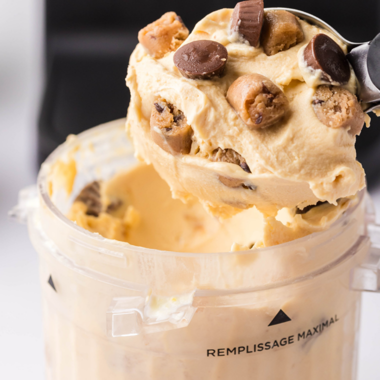 Ninja Creami Peanut Butter Cup Perfection ice cream scooped into a bowl and topped with peanut butter cups