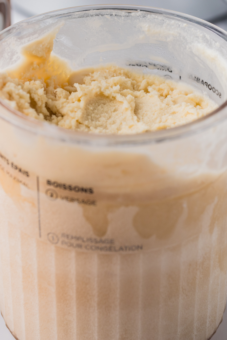 Ninja Creami root beer float Italian ice scooped into a glass topped with whipped cream and a straw
