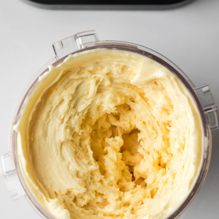 Smooth caramel gelato base with no undissolved powder, ready for the Ninja Creami pint