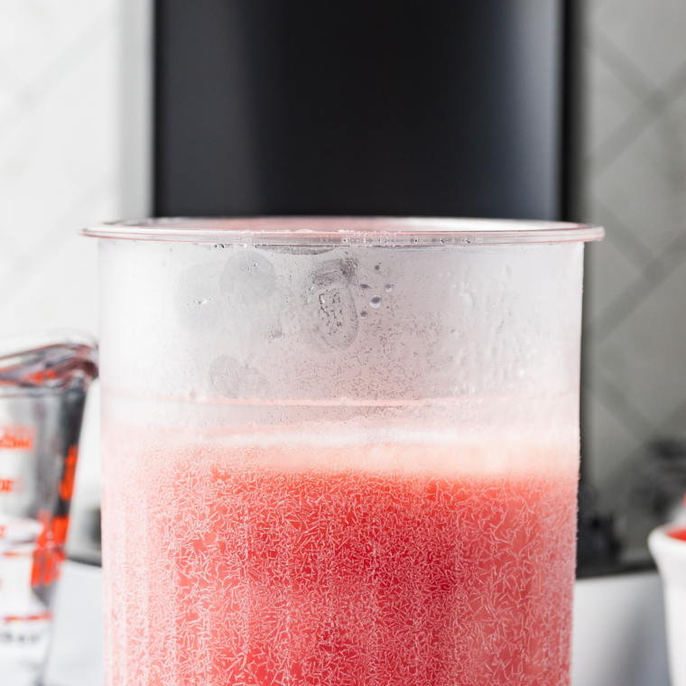 Frozen pint locked into the Ninja Creami machine set to the Italian Ice setting