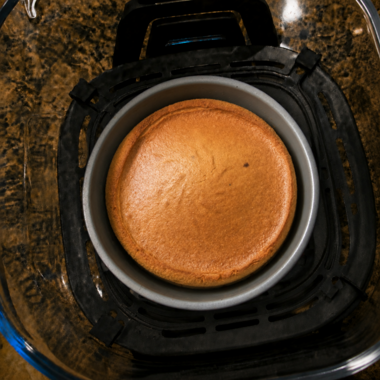 Toothpick inserted into the center of the cake to test for doneness