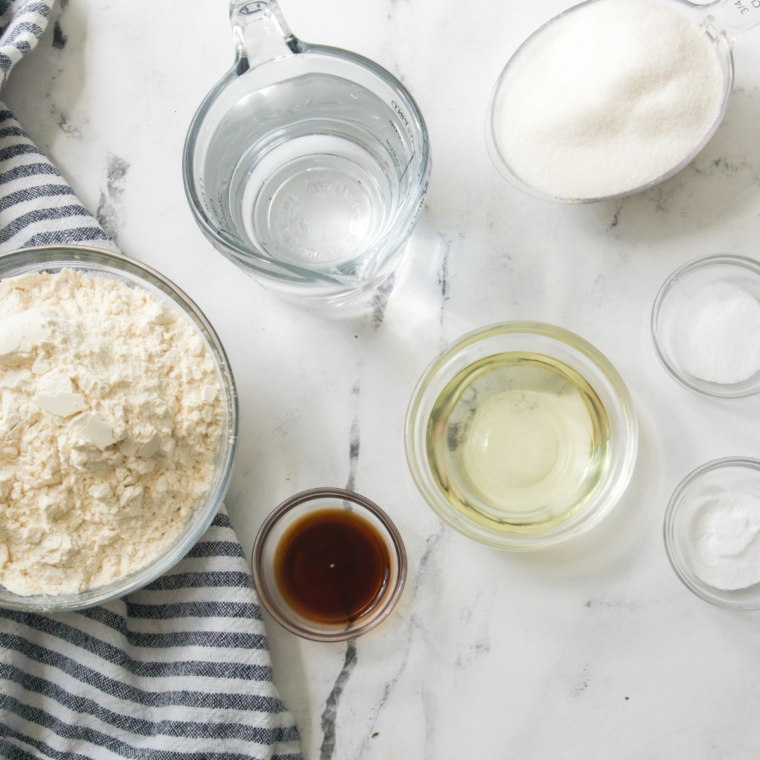 Ingredients for Ninja Crispi cake measured out in bowls on a counter