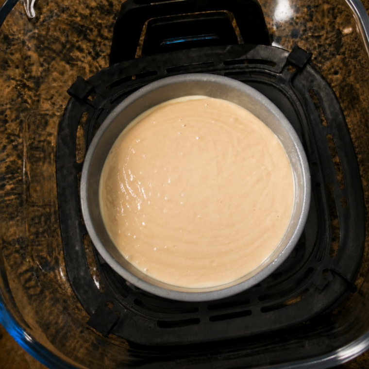 Cake batter poured into the 6-inch pan and filled two-thirds full
