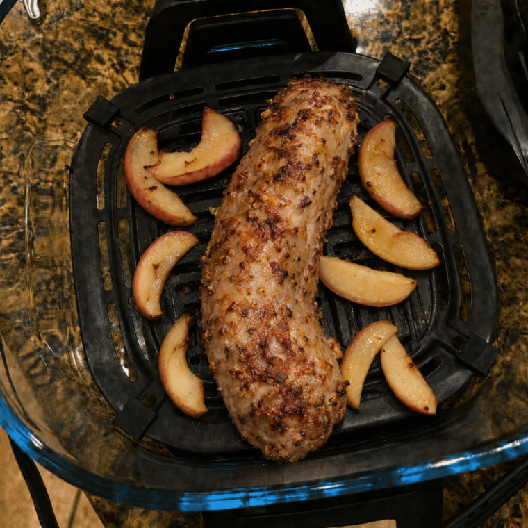 Golden crust forming on a Ninja Crispi pork tenderloin during the final minutes on Max Crisp
