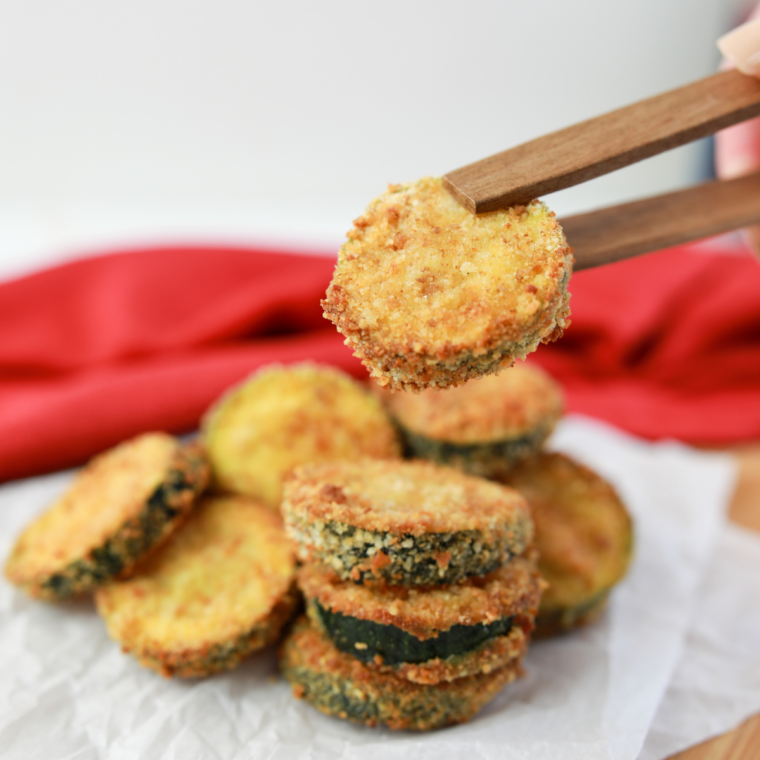 Golden Ninja Crispi zucchini fresh from the air fryer with a side of marinara