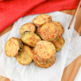 Ninja Crispi zucchini rounds with golden parmesan-panko crust on the crisper plate