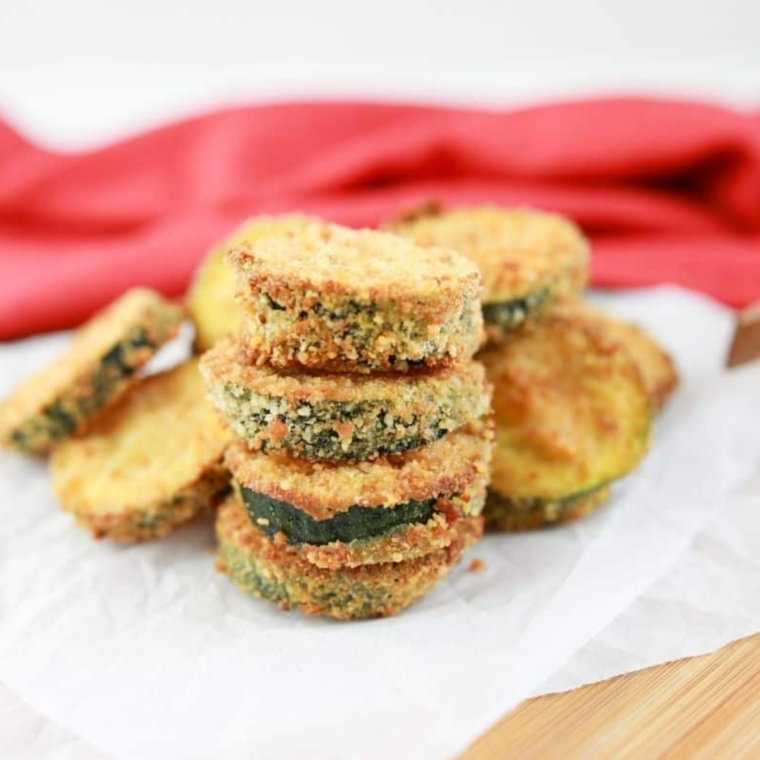 Crispy Ninja Crispi zucchini served with parmesan and a lemon wedge
