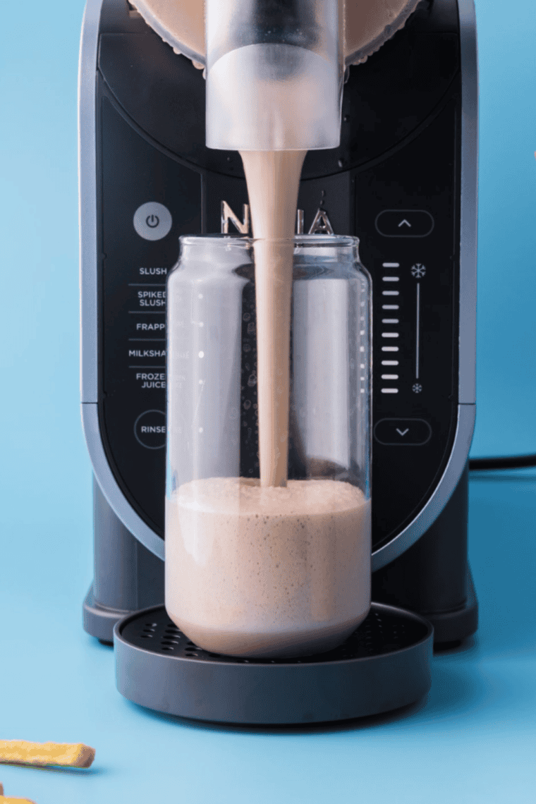 Ninja Slushi churning the base into a thick, frozen chocolate milkshake