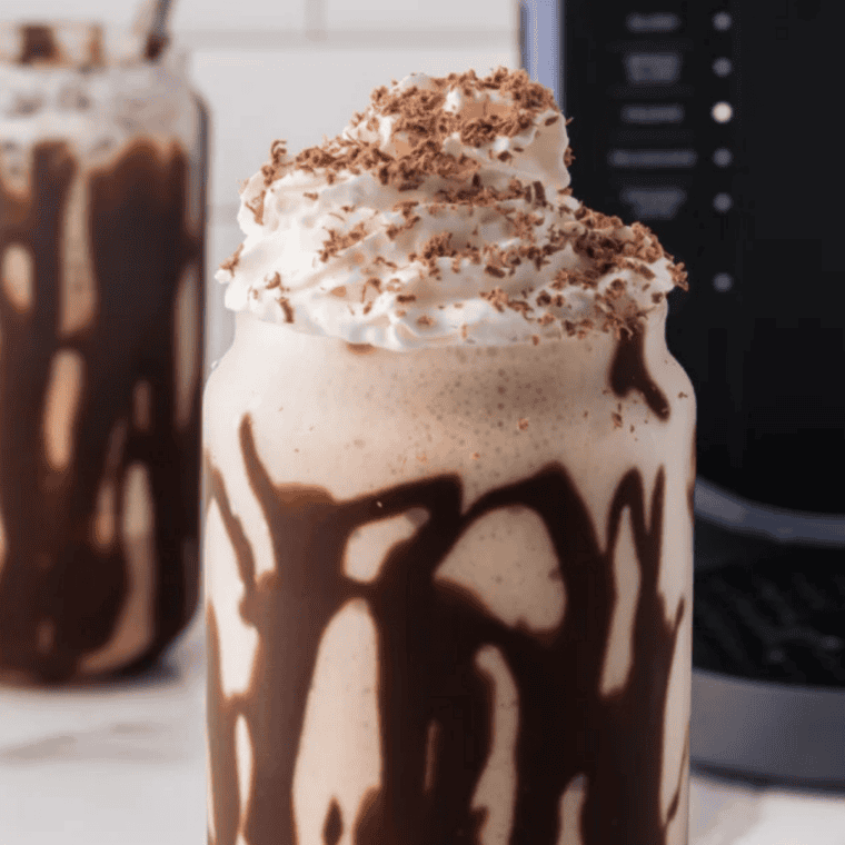 Close-up of a thick, frosty Ninja Slushi chocolate milkshake showing its spoonable texture