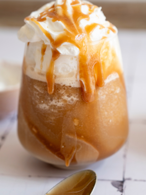 Ingredients for a Ninja Slushi mocha frappe: cold brew, milk, chocolate syrup, simple syrup, and vanilla
