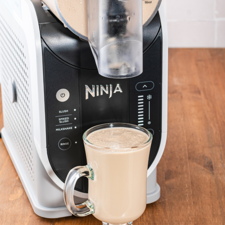 Pouring the mocha coffee mixture into the Ninja Slushi vessel through the fill port