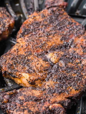 ooked bone-in Outlaw Ribeye steak on a plate with a dark seared crust