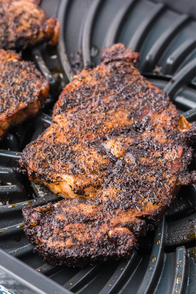 Seared Outlaw Ribeye resting on a board after cooking so the juices redistribute