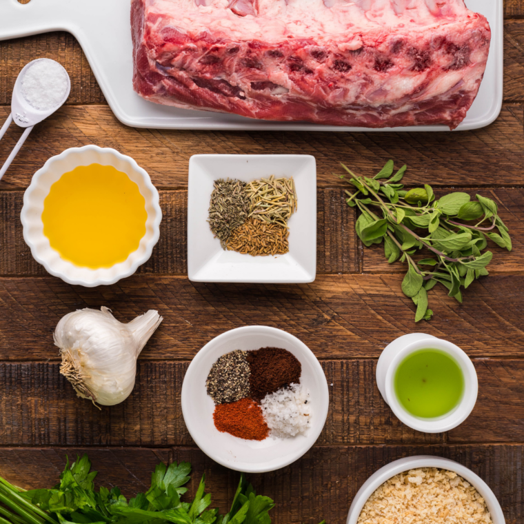 Ingredients for parmesan crusted lamb chops including lamb chops, parmesan, provolone, panko, heavy cream, garlic, and lemon