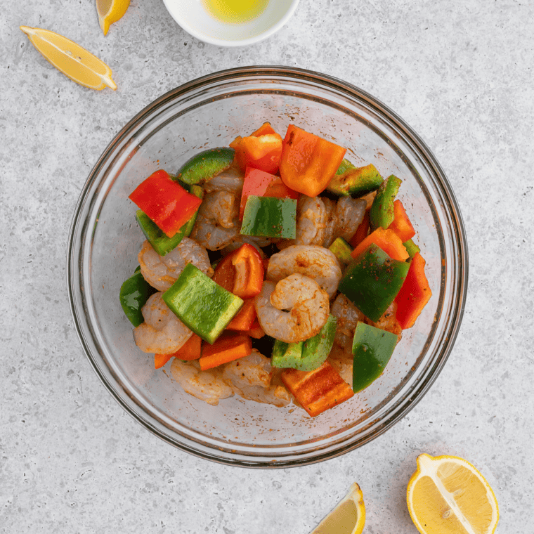 Whisking Cajun seasoning spices together in a bowl until evenly blended