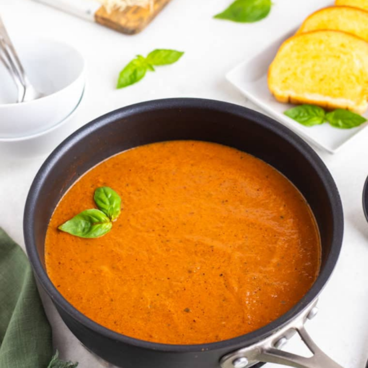 immersion blender pureeing tomato soup until completely smooth