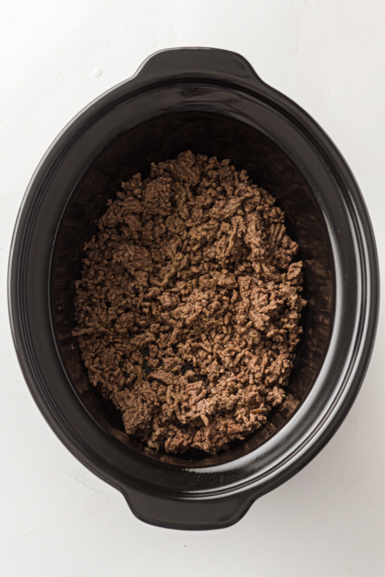 Ground beef browning in a skillet for cowboy casserole