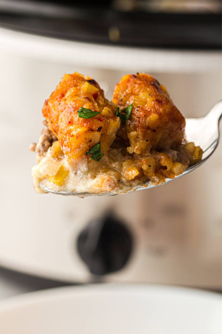 A scoop of hearty slow cooker cowboy casserole on a white plate