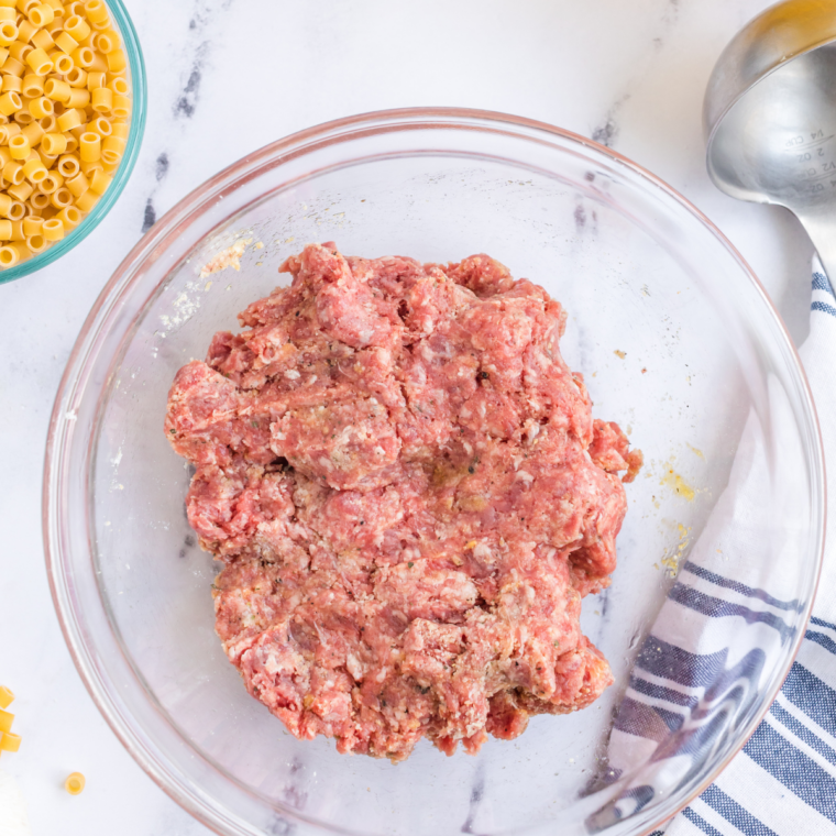 Ground chicken, panko, Parmesan, and dill mixed in a large bowl for Italian wedding soup meatballs
