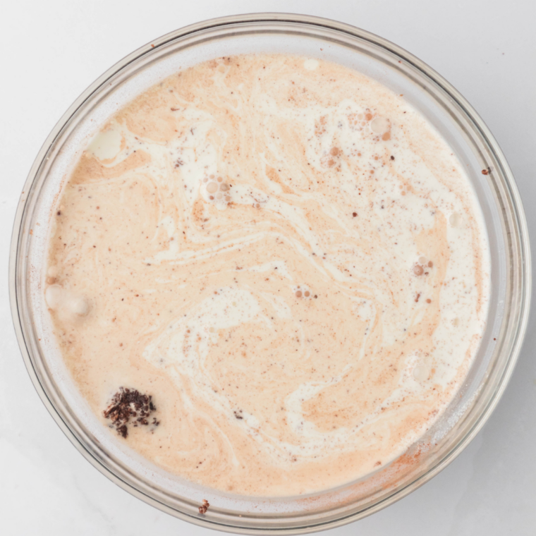 Heavy cream and vanilla whisked into the chocolate Ninja Creami base before cooling