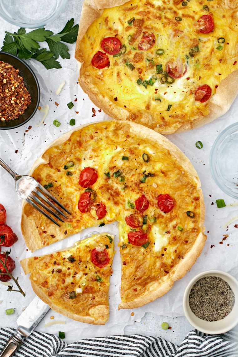 Fully cooked air fryer egg tortilla frittata on parchment paper, edges crisp and golden
